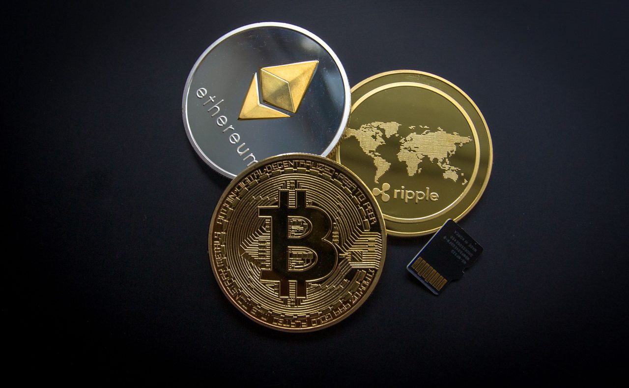 Bitcoin coin on a dark reflective surface